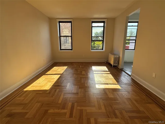 a view of bathroom with window and a rug