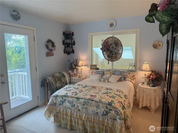 a bedroom with a bed and a mirror