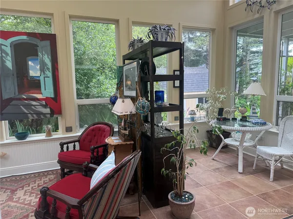 a room with furniture and a potted plant