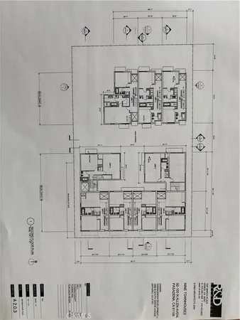 a kitchen with white cabinets and window