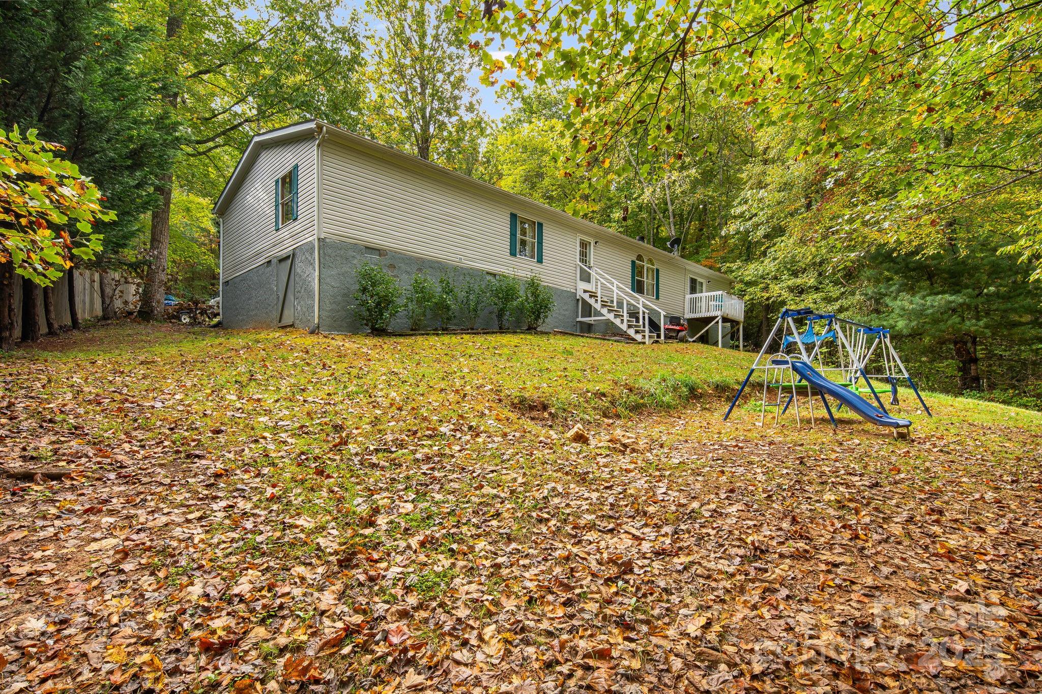 52 Rocky Cove Road Candler, NC 28715 - Photo 17 of 17 a house with a yard