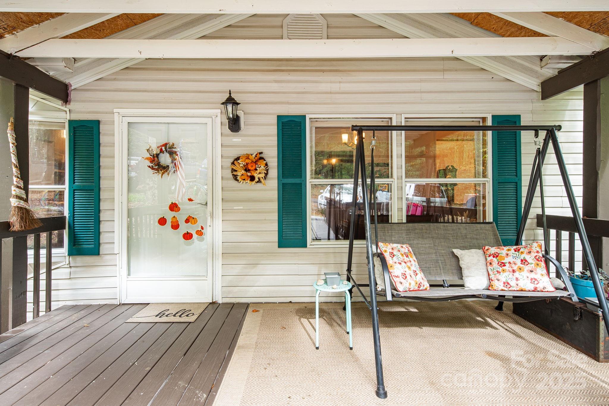52 Rocky Cove Road Candler, NC 28715 - Photo 2 of 17 a view of sitting area with furniture and floor to ceiling window