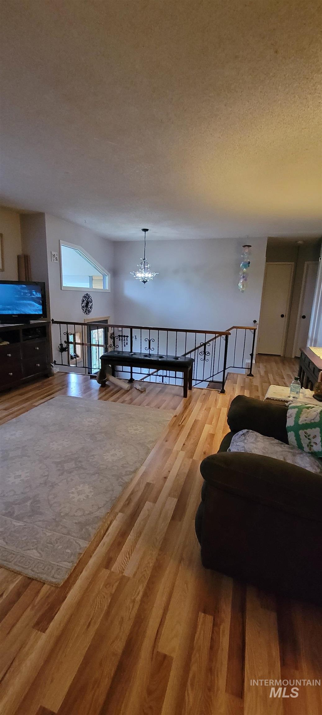 818 Baker Road Kamiah, ID 83536 - Photo 17 of 31 Wood-paneled interior featuring a built-in bench, wall-mounted thermometer, and a dark-toned heating unit