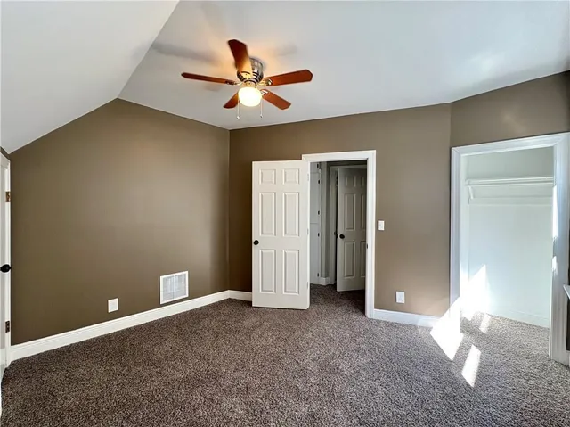 a view of a livingroom with a ceiling fan