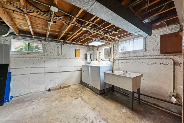 a view of a house with backyard sitting area and garden