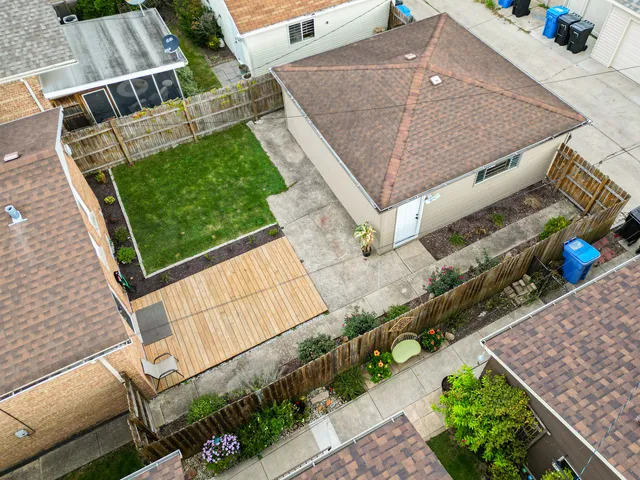 a view of house with a yard and seating space