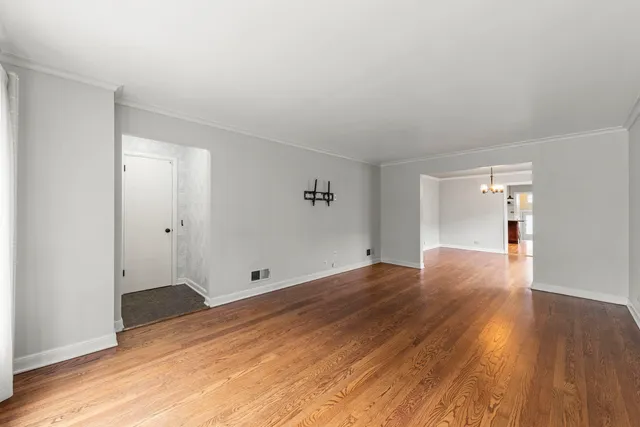 a view of wooden floor in an empty room
