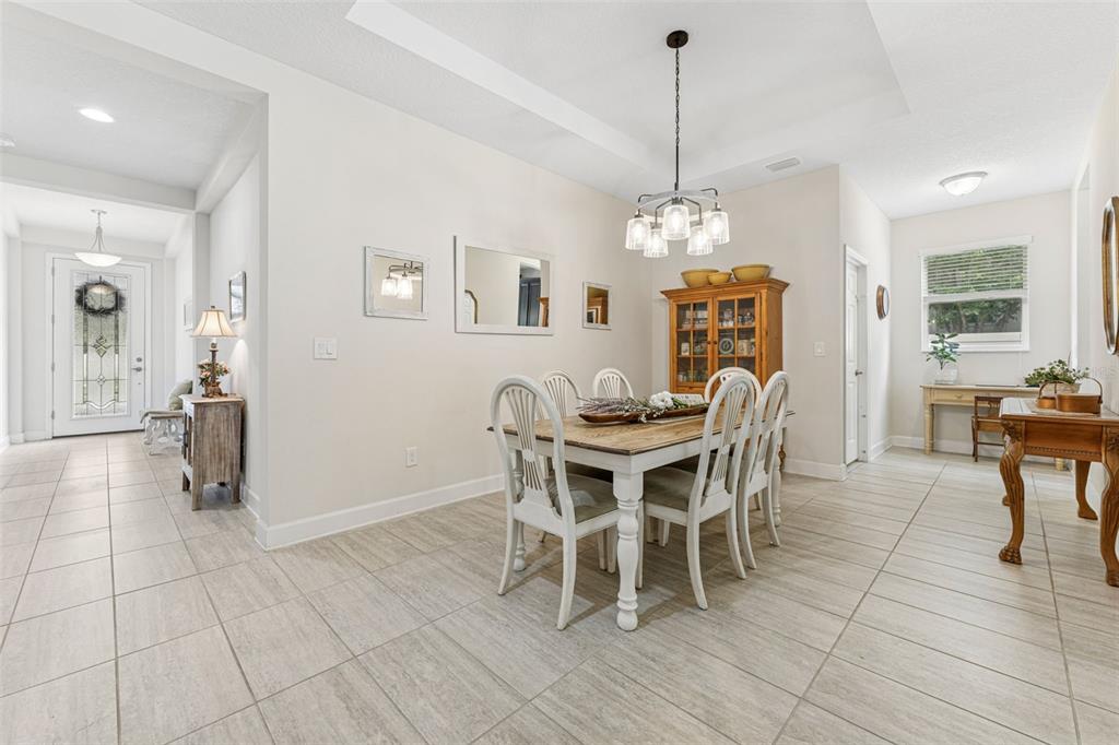 1237 Windy Bay Shoal Tarpon Springs, FL 34689 - Photo 11 of 44 a view of a dining room with furniture
