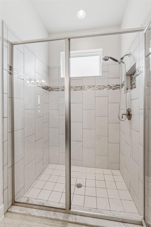 1237 Windy Bay Shoal Tarpon Springs, FL 34689 - Photo 25 of 44 a bathroom with a shower