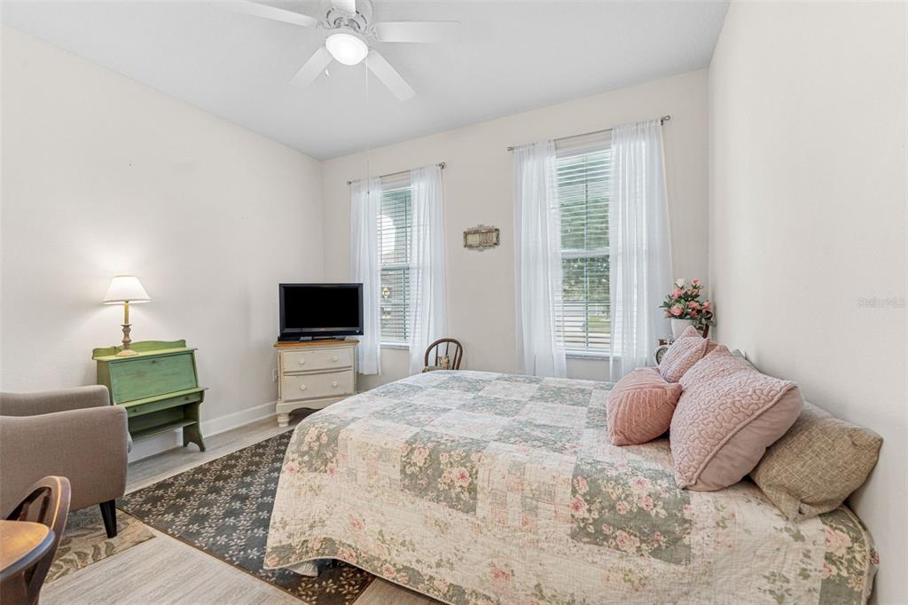 1237 Windy Bay Shoal Tarpon Springs, FL 34689 - Photo 26 of 44 a bedroom with a bed and a flat screen tv