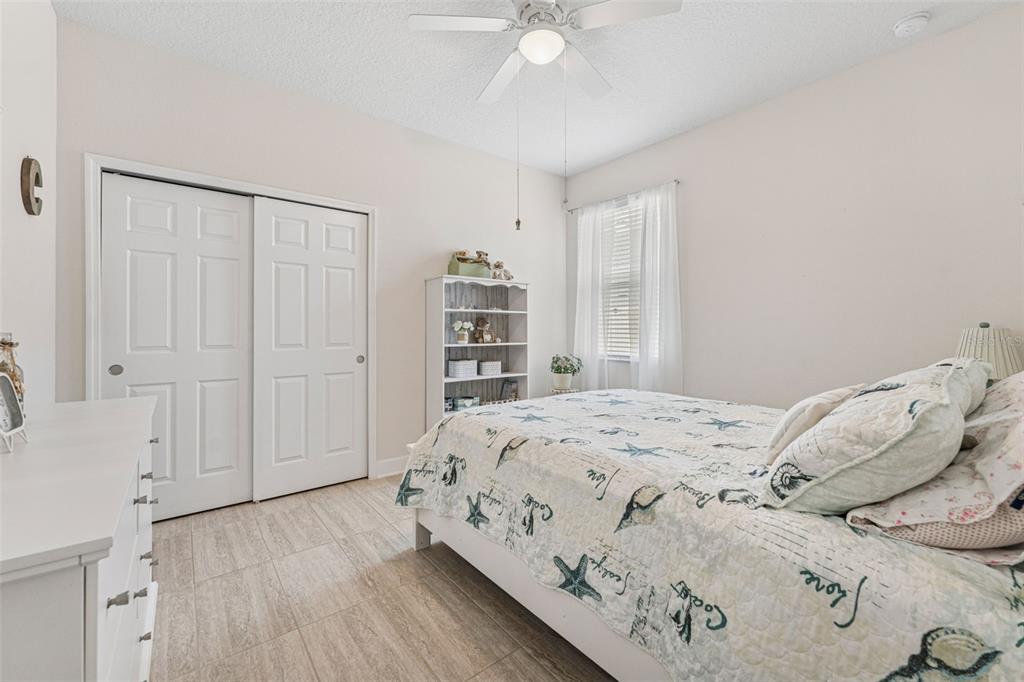 1237 Windy Bay Shoal Tarpon Springs, FL 34689 - Photo 29 of 44 a bedroom with a bed and a closet