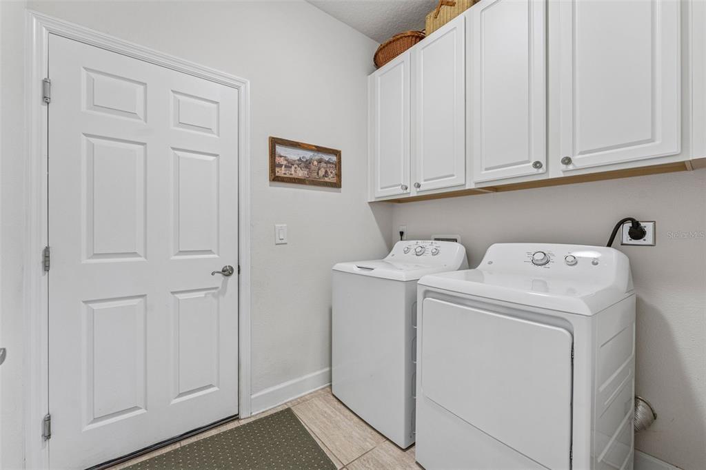 1237 Windy Bay Shoal Tarpon Springs, FL 34689 - Photo 31 of 44 a utility room with dryer and washer