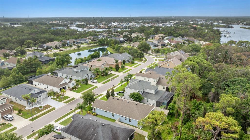 1237 Windy Bay Shoal Tarpon Springs, FL 34689 - Photo 5 of 44 an aerial view of residential houses with outdoor space