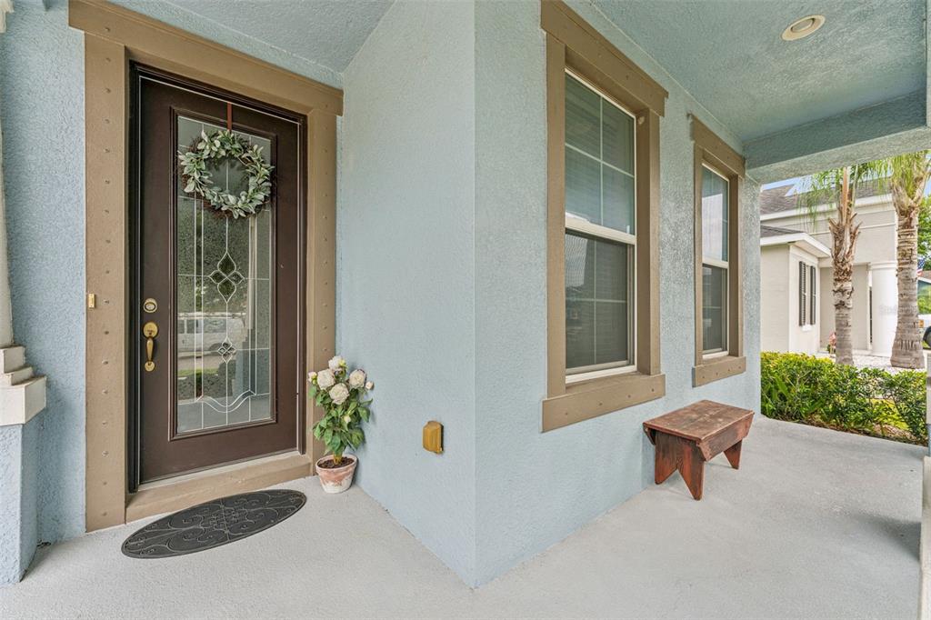 1237 Windy Bay Shoal Tarpon Springs, FL 34689 - Photo 9 of 44 a living room with a couch and a potted plant