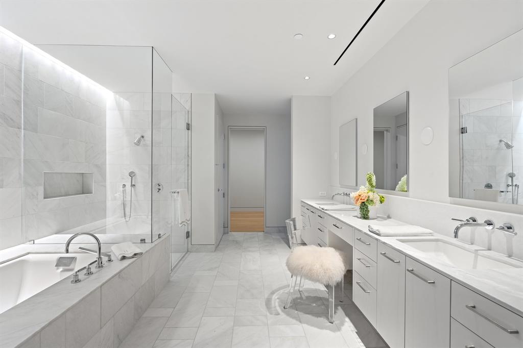 1747 Leonard Street, Unit 2402 Dallas, TX 75201 - Photo 16 of 35 a bathroom with a granite countertop sink mirror and double