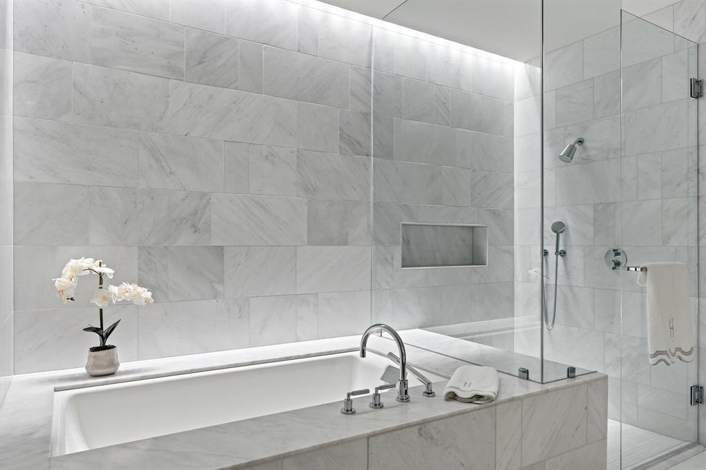 1747 Leonard Street, Unit 2402 Dallas, TX 75201 - Photo 17 of 35 a bathroom with a sink and mirror