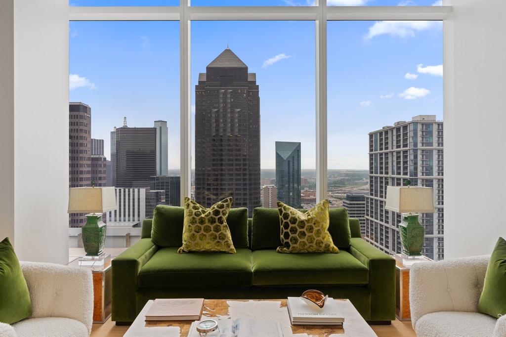 1747 Leonard Street, Unit 2402 Dallas, TX 75201 - Photo 18 of 35 a living room with furniture and a floor to ceiling window