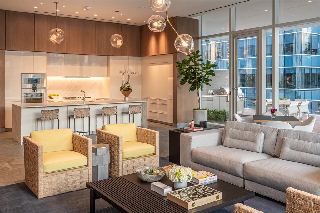 1747 Leonard Street, Unit 2402 Dallas, TX 75201 - Photo 23 of 35 a living room with furniture and a large window