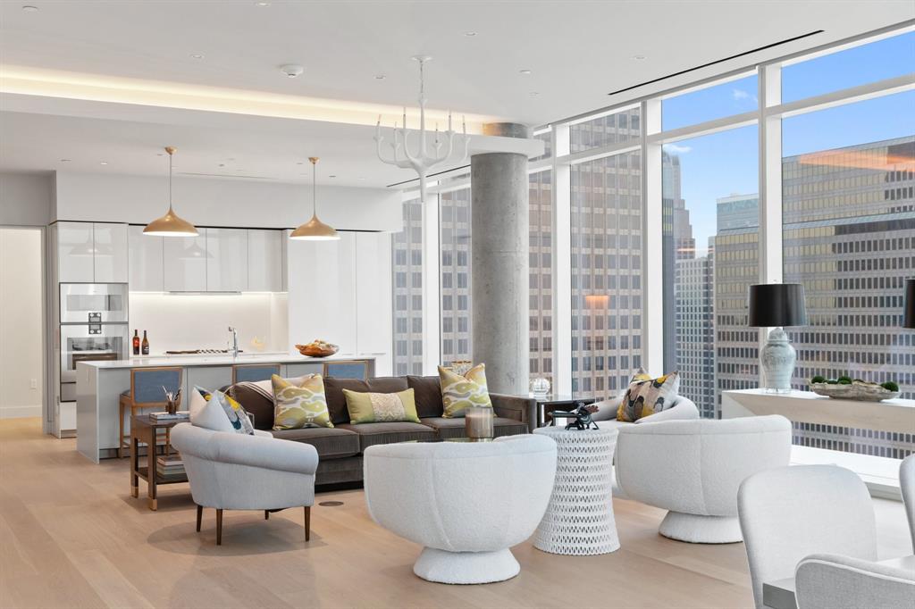 1747 Leonard Street, Unit 2402 Dallas, TX 75201 - Photo 6 of 35 a living room with furniture and a large window