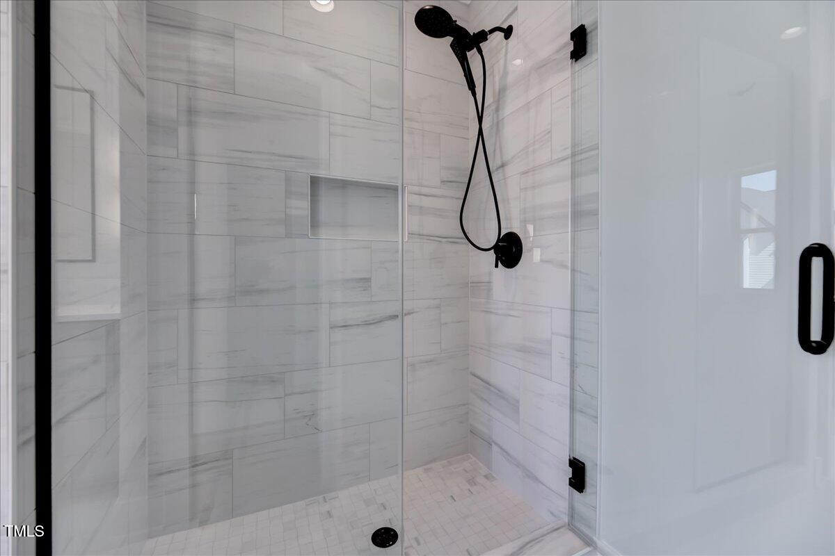 811 Maple Berry Lane, Unit 106 Raleigh, NC 27607 - Photo 14 of 30 a bathroom with a shower