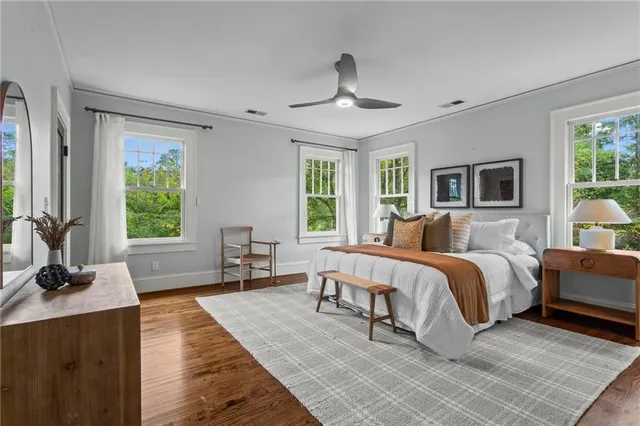 a spacious bedroom with a large bed and a couch