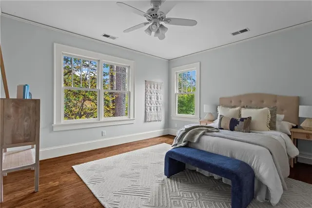 a bedroom with bed and window
