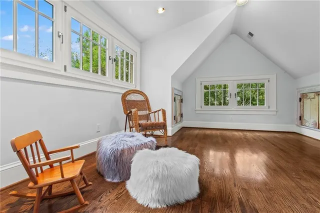 a room with a window and a chair