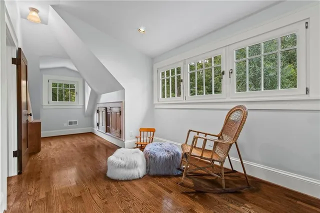 a bedroom with furniture and a window