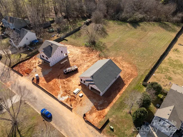 an aerial view of house with yard