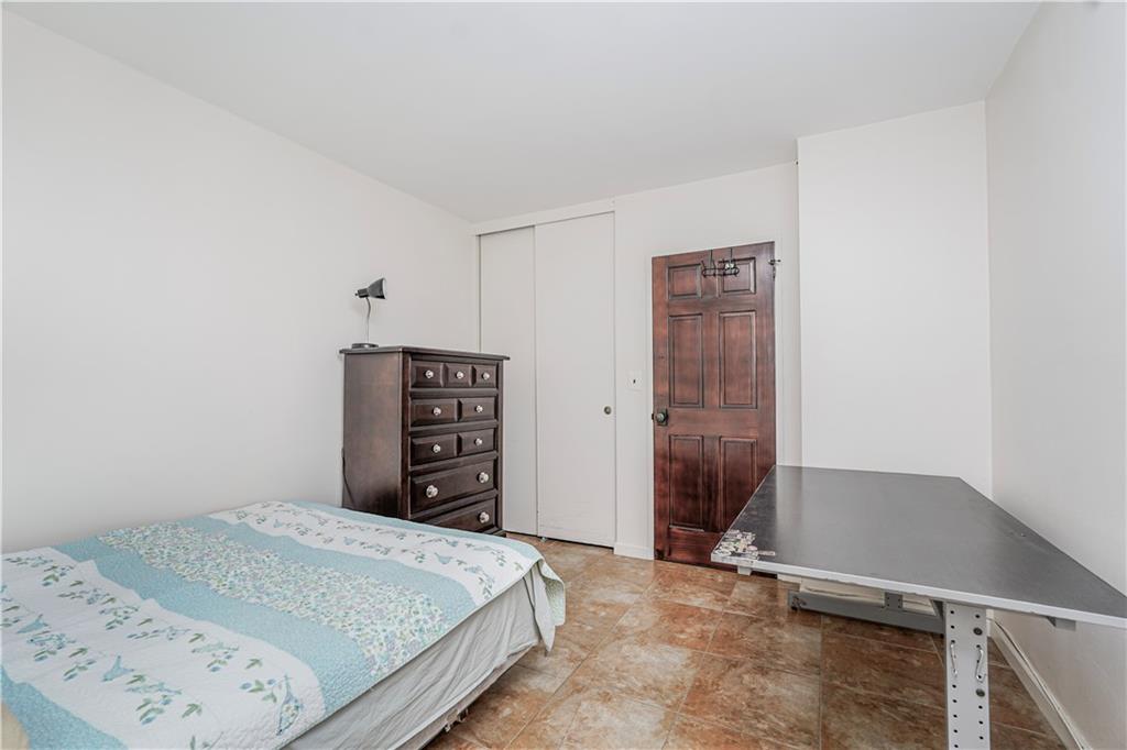 2930 West 5th Street, Unit 5F Brooklyn, NY 11224 - Photo 13 of 20 a bedroom with a bed and cabinets