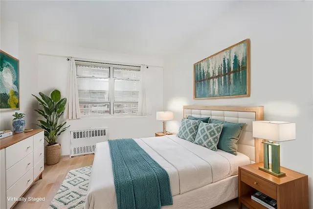 a bedroom with bed and a window