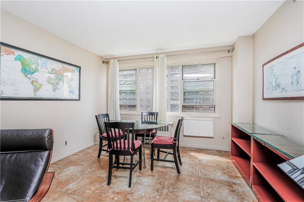 2930 West 5th Street, Unit 5F Brooklyn, NY 11224 - Photo 7 of 20 a view of a dining room with furniture and a window