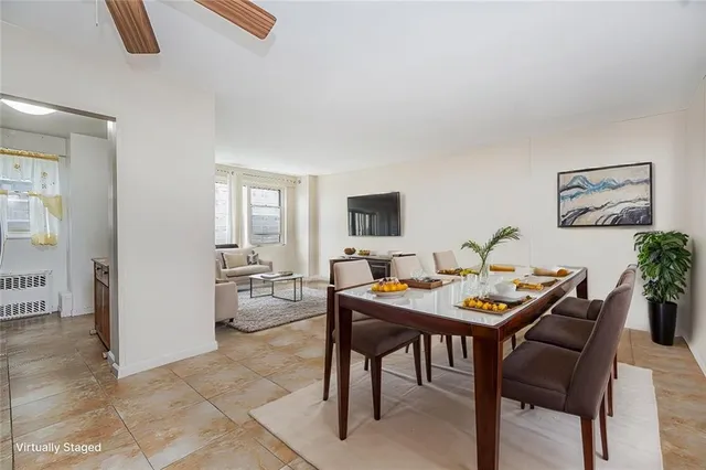 a view of a livingroom with furniture and a table