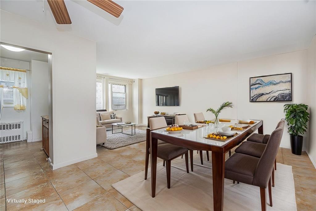 2930 West 5th Street, Unit 5F Brooklyn, NY 11224 - Photo 8 of 20 a view of a livingroom with furniture and a table