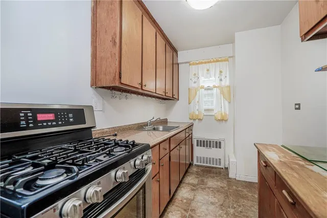 a kitchen with a stove and a microwave