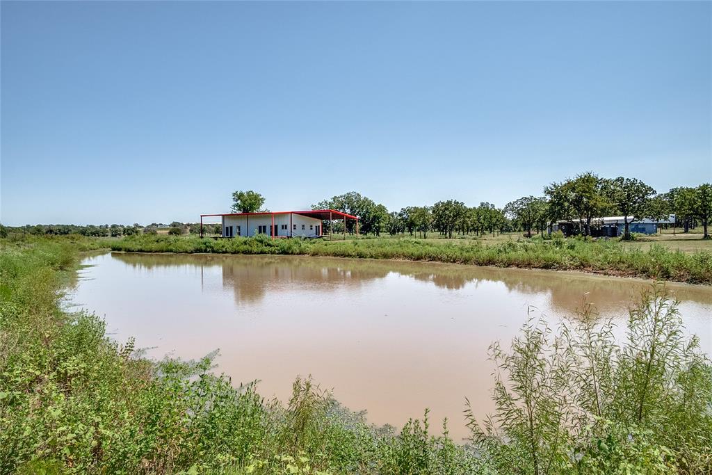 1070 Paradise Oaks Perrin, TX 76486 - Photo 12 of 17 a view of a lake with houses in the back