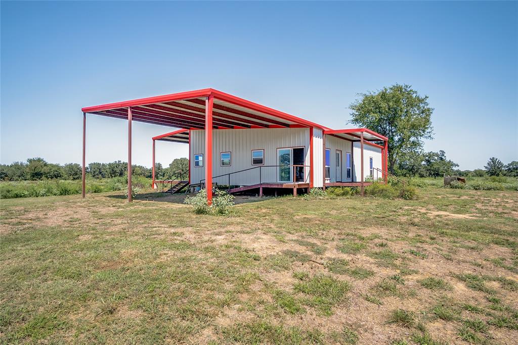 1070 Paradise Oaks Perrin, TX 76486 - Photo 3 of 17 a view of a house with backyard and porch
