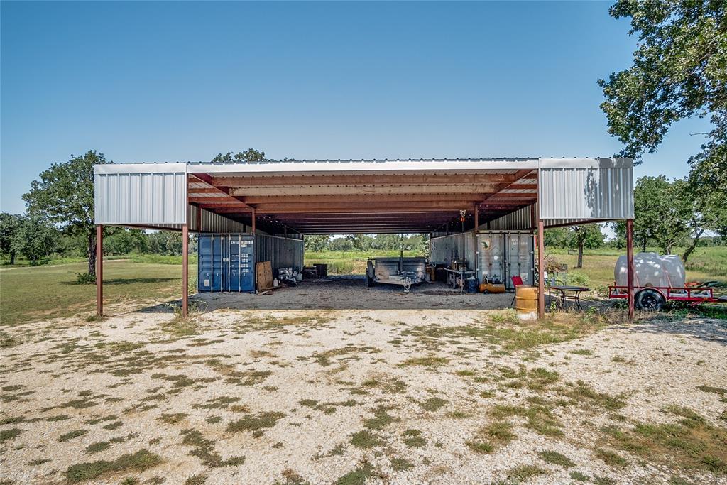 1070 Paradise Oaks Perrin, TX 76486 - Photo 7 of 17 a view of a house with floor to ceiling windows and a basket ball poll
