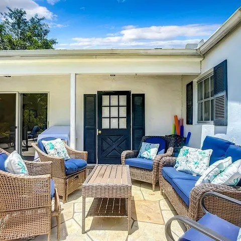 a outdoor living space with furniture and a potted plant