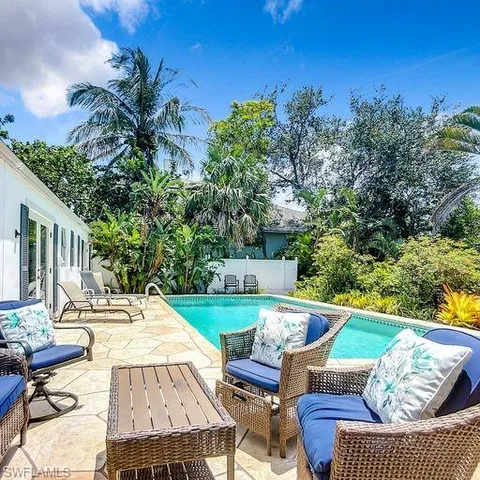 a view of backyard with seating space