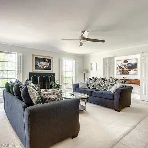 a living room with furniture and a window