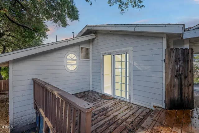 a view of an empty room with refrigerator