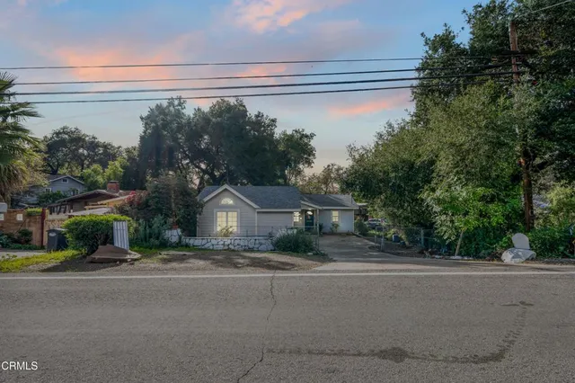 a view of a house with a street