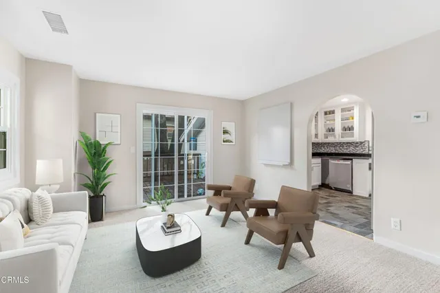 a living room with furniture and window