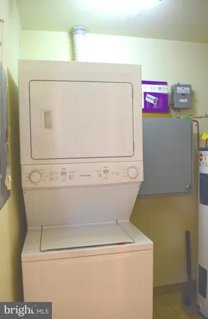 a front view of a house with outdoor seating