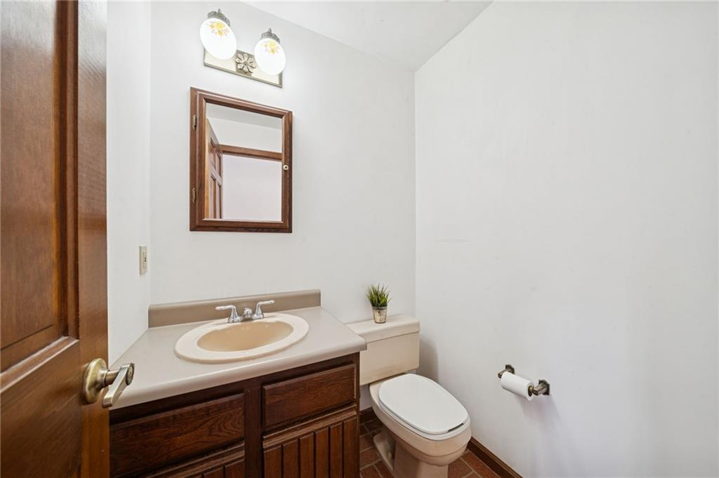 2530 Pleasant Valley Road Murrysville, PA 15668 - Photo 14 of 33 a bathroom with a sink toilet mirror vanity and toilet