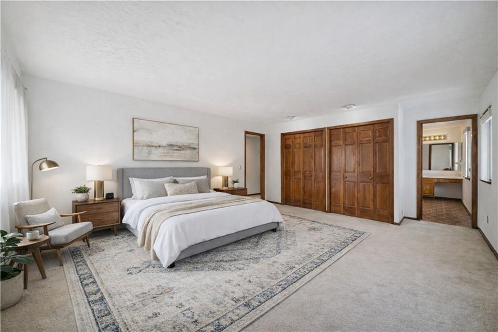 2530 Pleasant Valley Road Murrysville, PA 15668 - Photo 16 of 33 a spacious bedroom with a bed and a couch