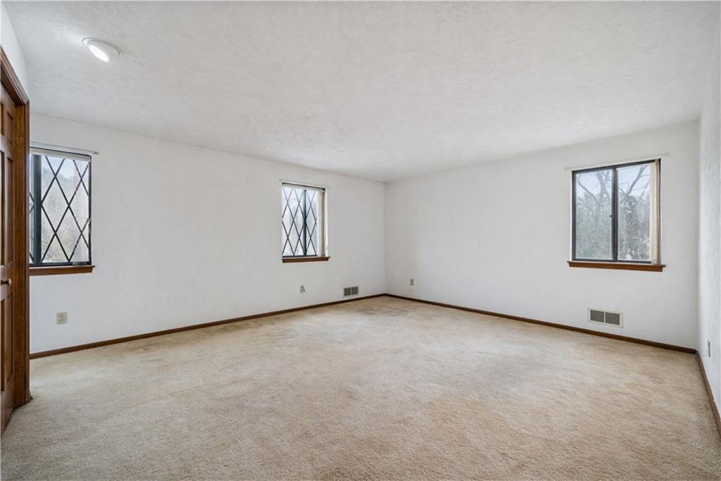 2530 Pleasant Valley Road Murrysville, PA 15668 - Photo 17 of 33 an empty room with windows and closet