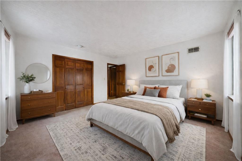 2530 Pleasant Valley Road Murrysville, PA 15668 - Photo 19 of 33 a spacious bedroom with a bed and dresser