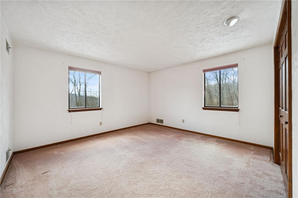 2530 Pleasant Valley Road Murrysville, PA 15668 - Photo 20 of 33 an empty room with windows and closet
